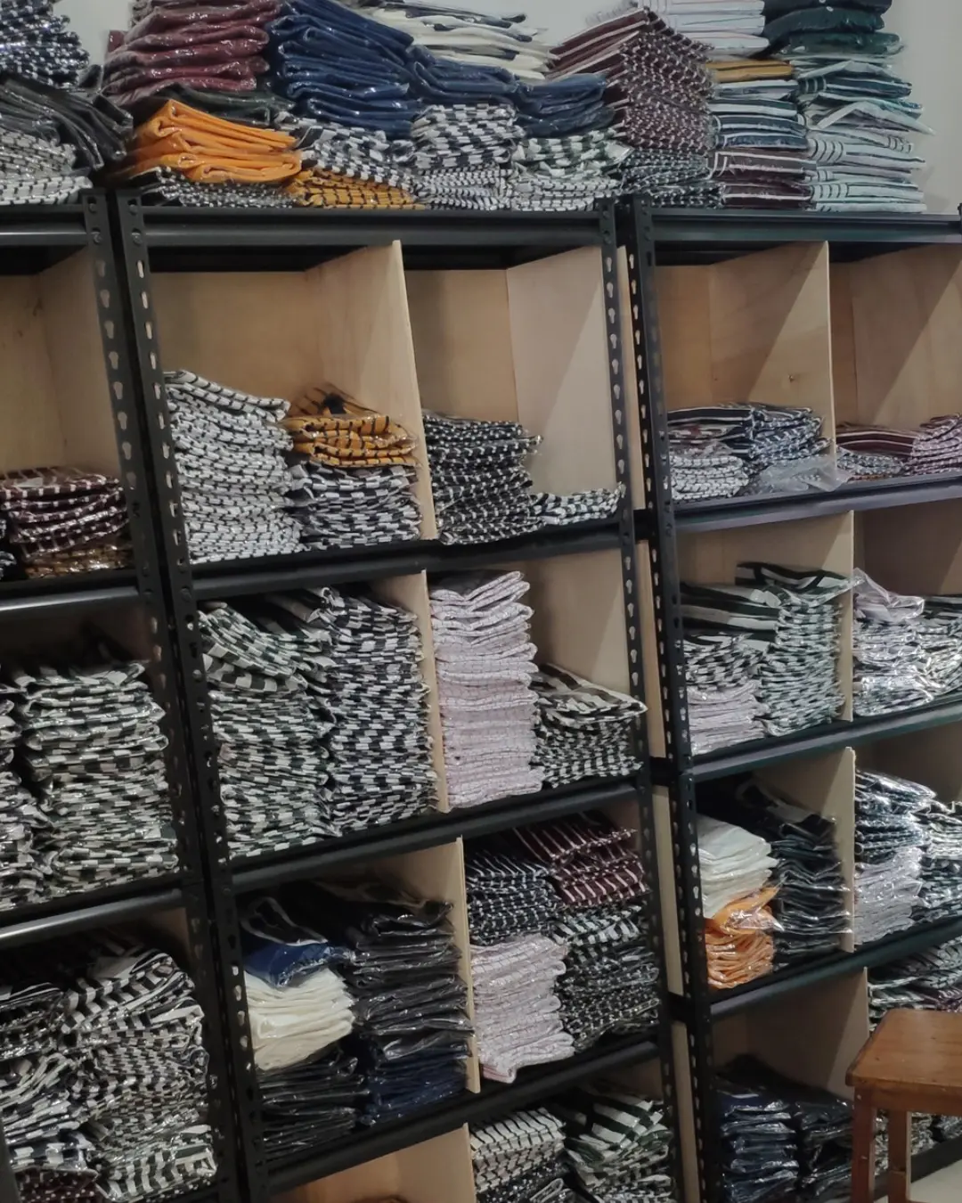Early OXFOORD garment stock arranged on shelves